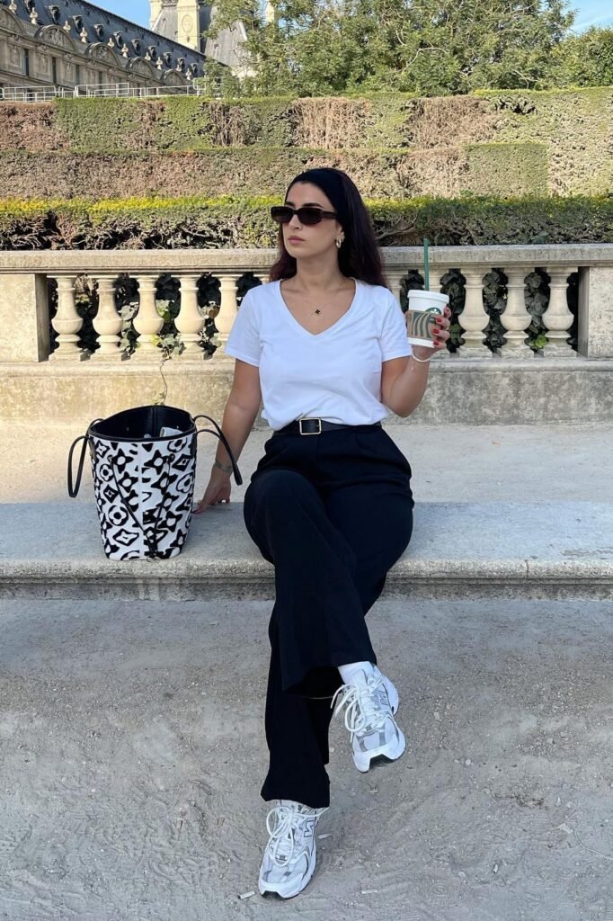 White V-Neck T-Shirt + Black High-Waisted Trousers + White Athletic Sneakers