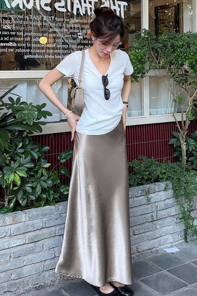 White V-Neck T-Shirt + Champagne Satin Maxi Skirt + Black Ballet Flats