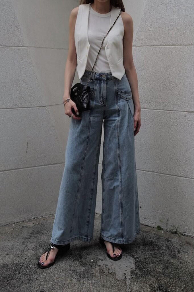 White Vest & Ribbed Tank + Light Wash Seamed Wide-Leg Jeans + Black Thong Sandals