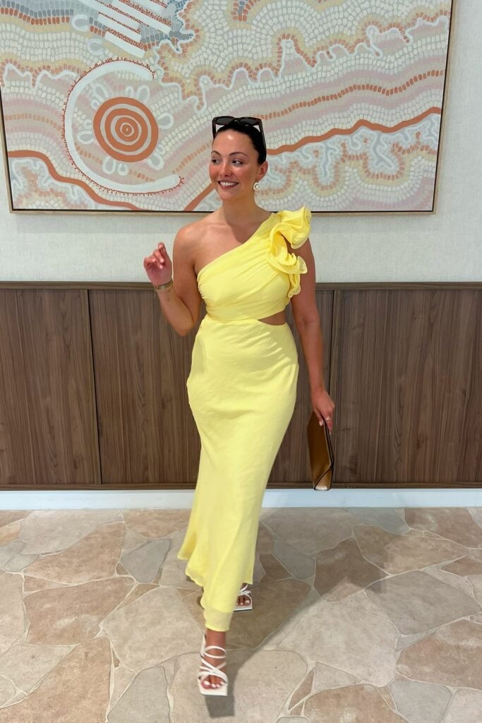 Yellow One-Shoulder Ruffle Maxi Dress + White Strappy Sandals + Gold Clutch