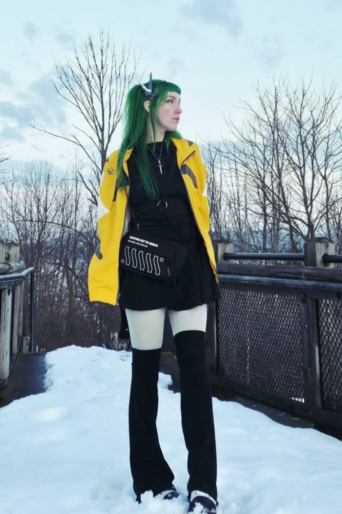 Yellow Techwear Jacket + Black Mini Skirt + White Tights + Black Knee-High Leg Warmers