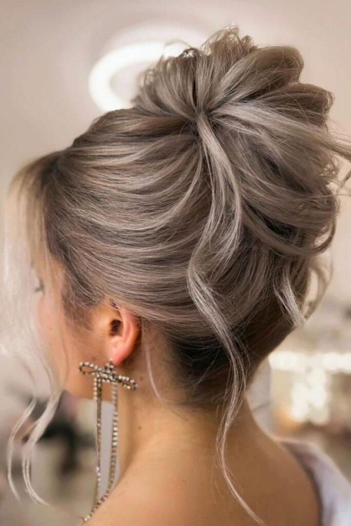 Airy Messy Updo with Wispy Face-Framing Strands