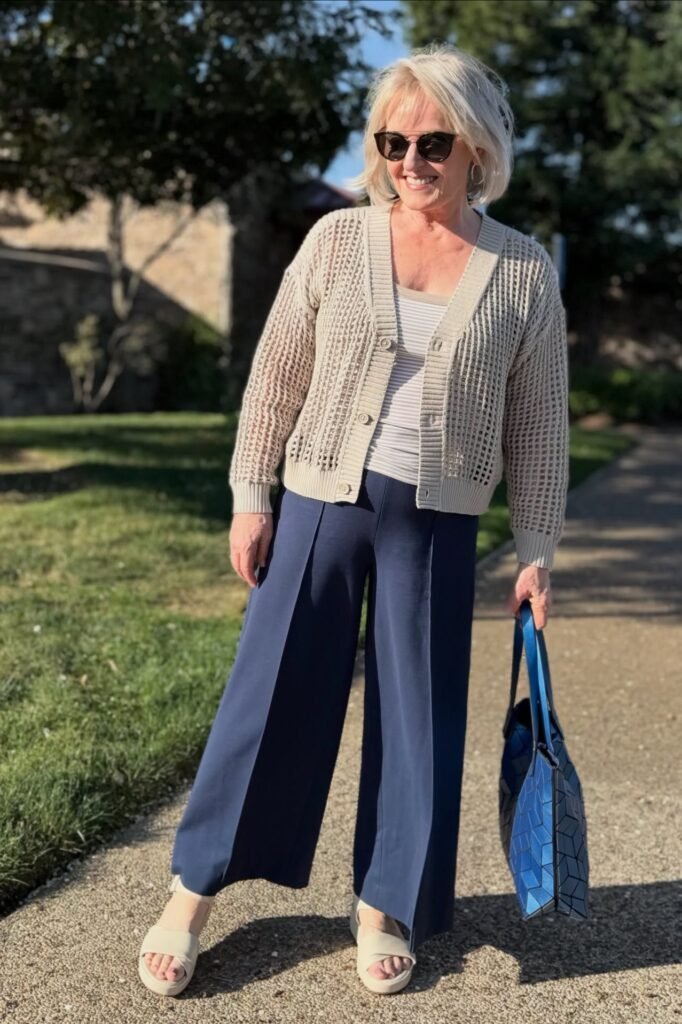 Beige Mesh Cardigan + Striped Tank Top + Navy Blue Wide-Leg Trousers + Off-White Platform Sandals
