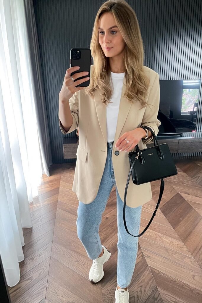 Beige Oversized Blazer + White T-Shirt + Light Wash Straight Jeans + White Sneakers + Black Handbag