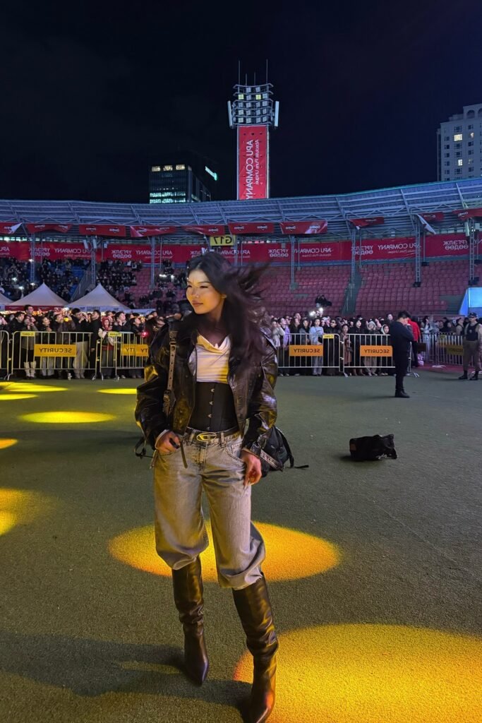 Black Distressed Leather Bomber Jacket + White Drape-Neck Top + Grey Baggy Jeans + Black Knee-High Pointed Boots