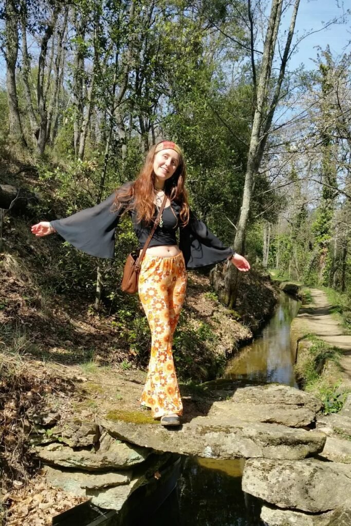 Black Flare-Sleeve Crop Top + Orange Floral Flare Pants + Black Boots