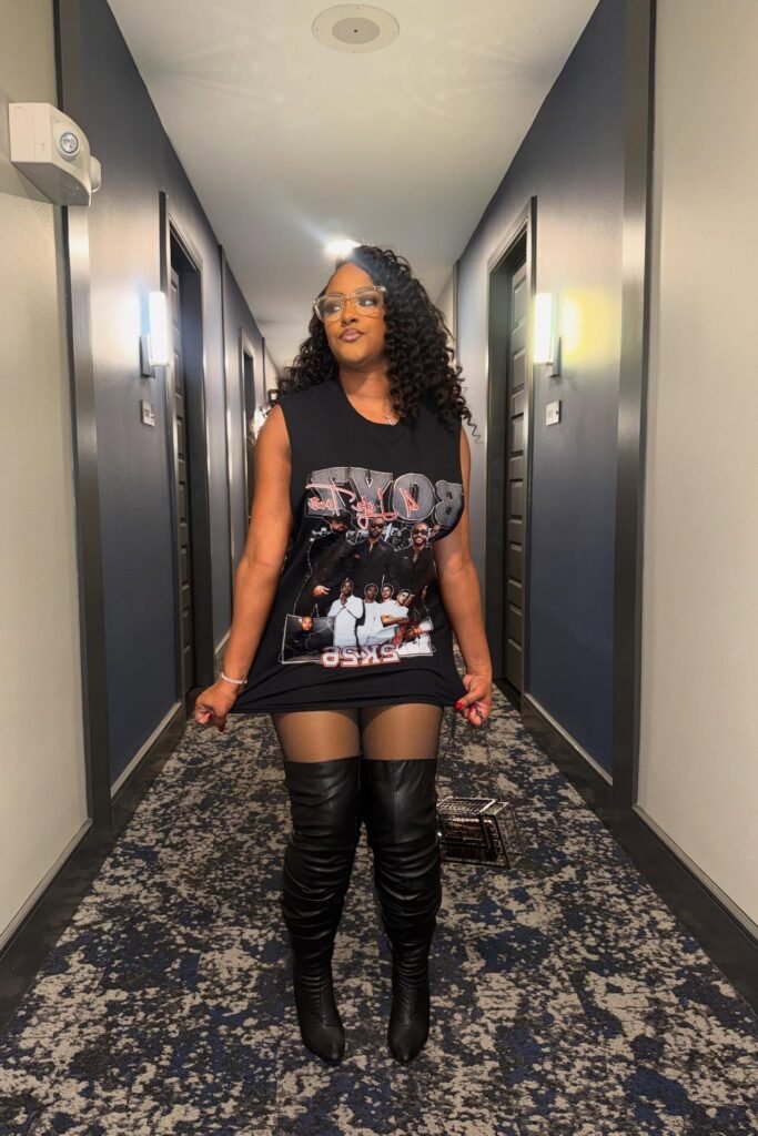 Black Graphic Muscle Tee + Black Thigh-High Leather Boots + Black Mini Handbag