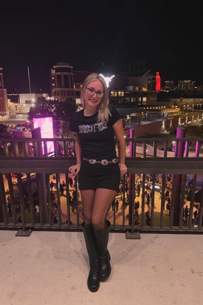 Black Graphic T-Shirt + Black Mini Skirt + Silver Concho Belt + Black Knee-High Boots