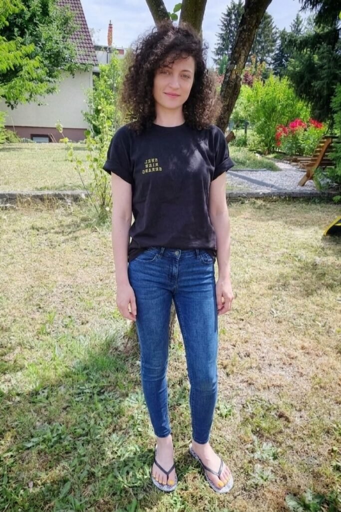 Black Graphic T-Shirt + Slim Fit Dark Wash Jeans + Patterned Flip Flops