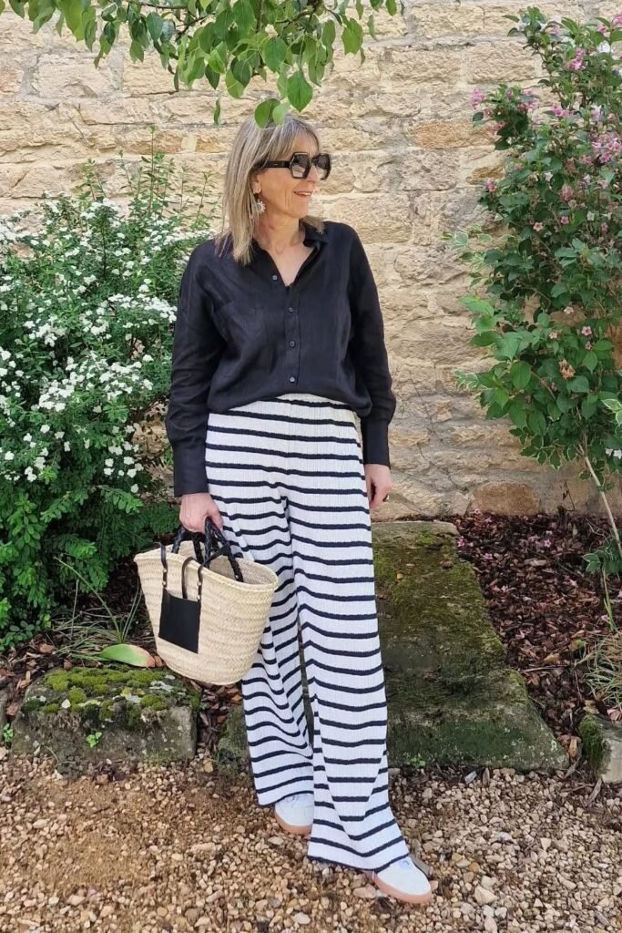 Black Linen Shirt + Black and White Striped Wide-Leg Trousers + White Sneakers
