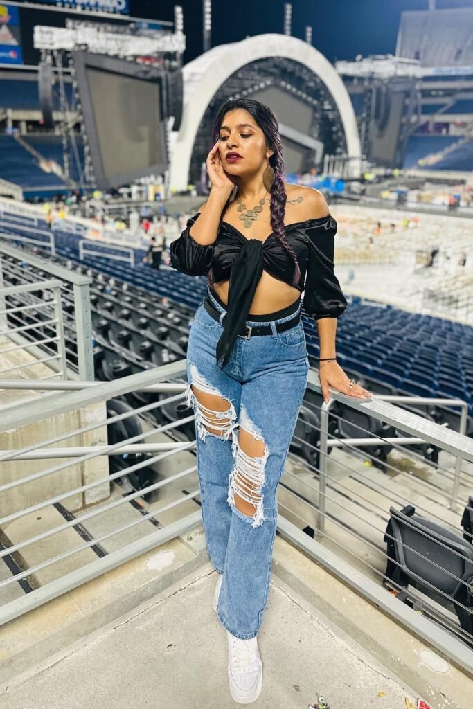 Black Off-the-Shoulder Tie-Front Crop Top + Distressed Light-Wash Jeans + White High-Top Sneakers