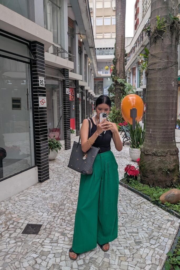 Black Ribbed Tank Top + High-Waisted Green Wide-Leg Trousers + Black Slide Sandals