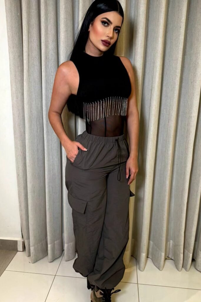 Black Sleeveless Fringe Crop Top + Grey Cargo Pants + Black and Brown Boots