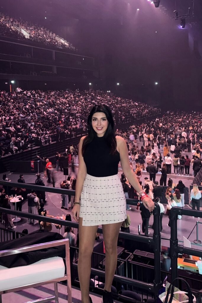 Black Sleeveless Mock-Neck Top + White Plaid Mini Skirt + Black Sneakers