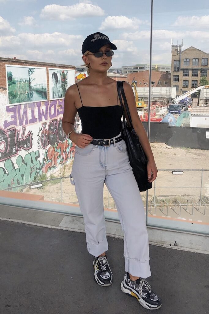 Black Spaghetti Strap Bodysuit + Light Wash Straight-Leg Jeans + Black and Grey Chunky Sneakers