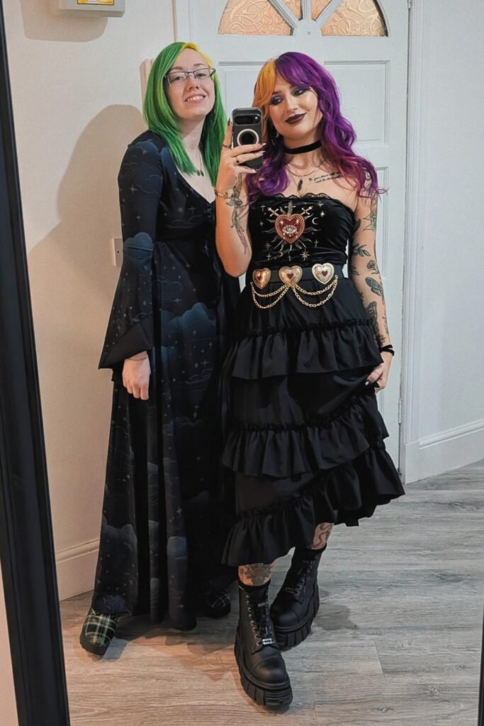 Black Strapless Tiered Ruffle Dress + Heart-Embellished Chain Belt + Black Platform Boots