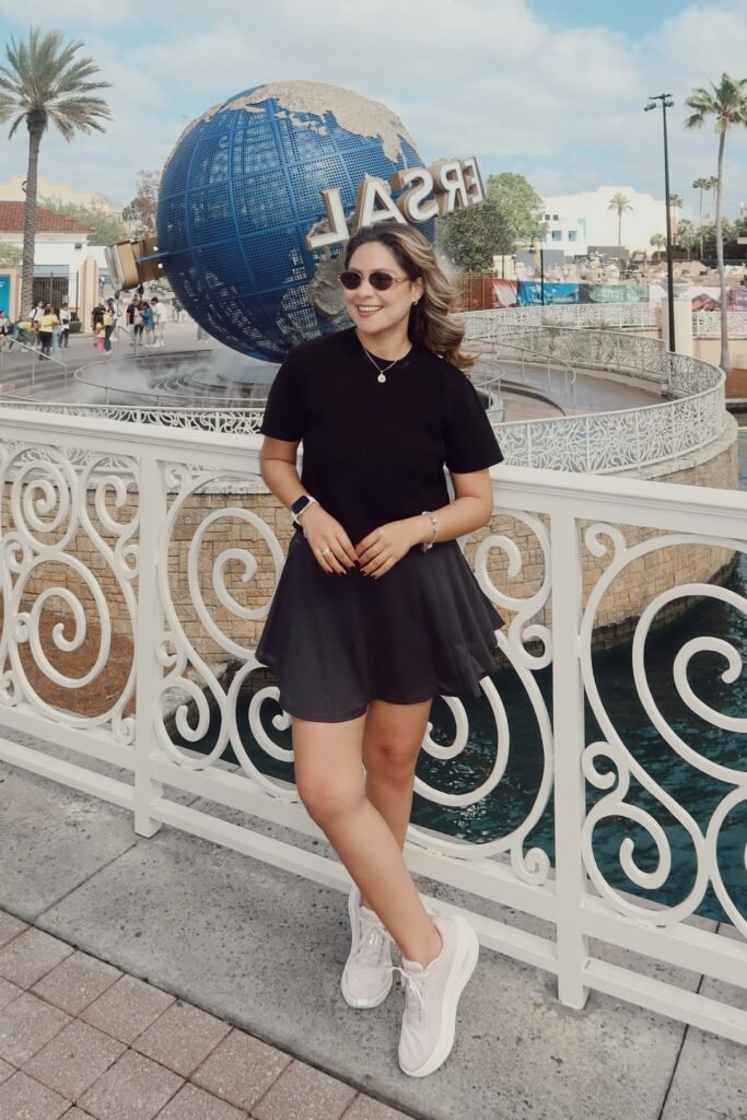 Black T-Shirt + Black Mini Skirt + Pink Athletic Sneakers