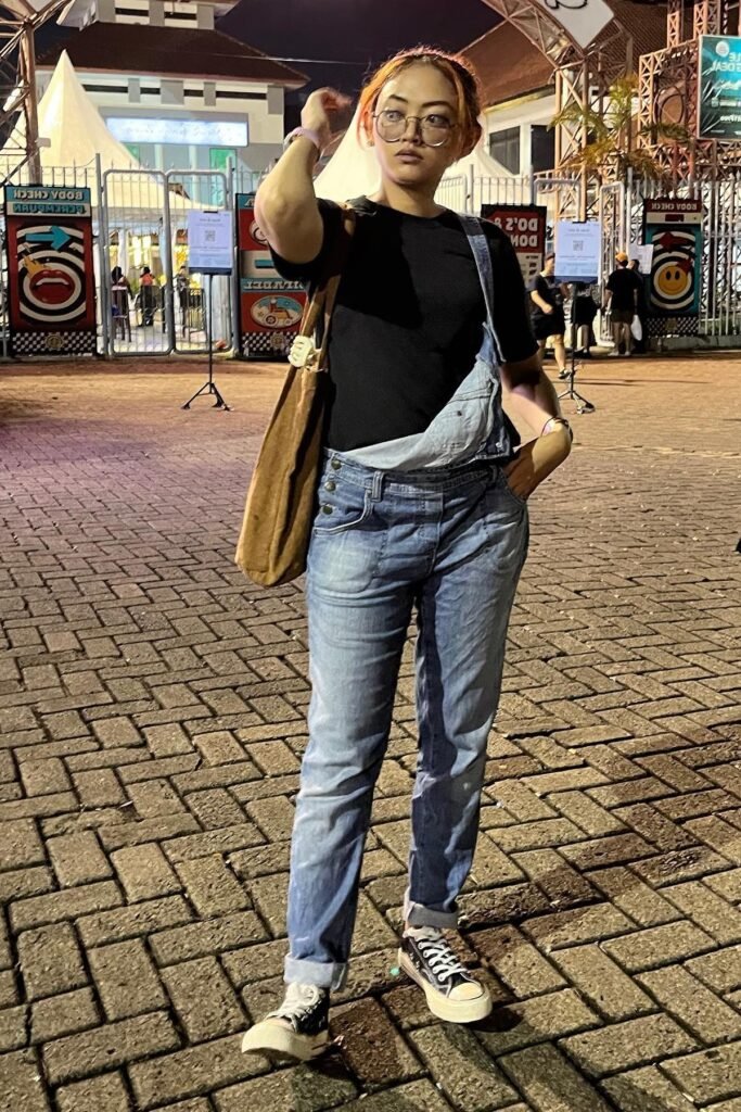 Black T-Shirt + Denim Overalls + Black and White High-Top Sneakers