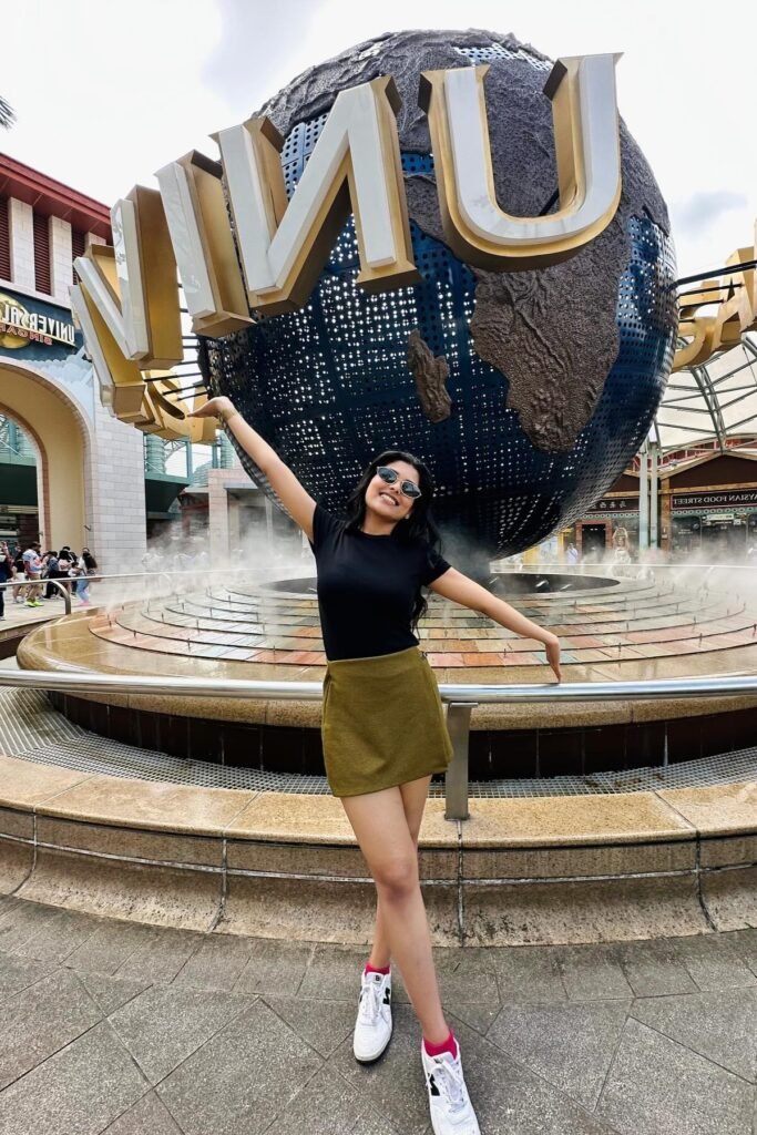 Black T-Shirt + Olive Green Mini Skirt + White Sneakers with Pink Socks