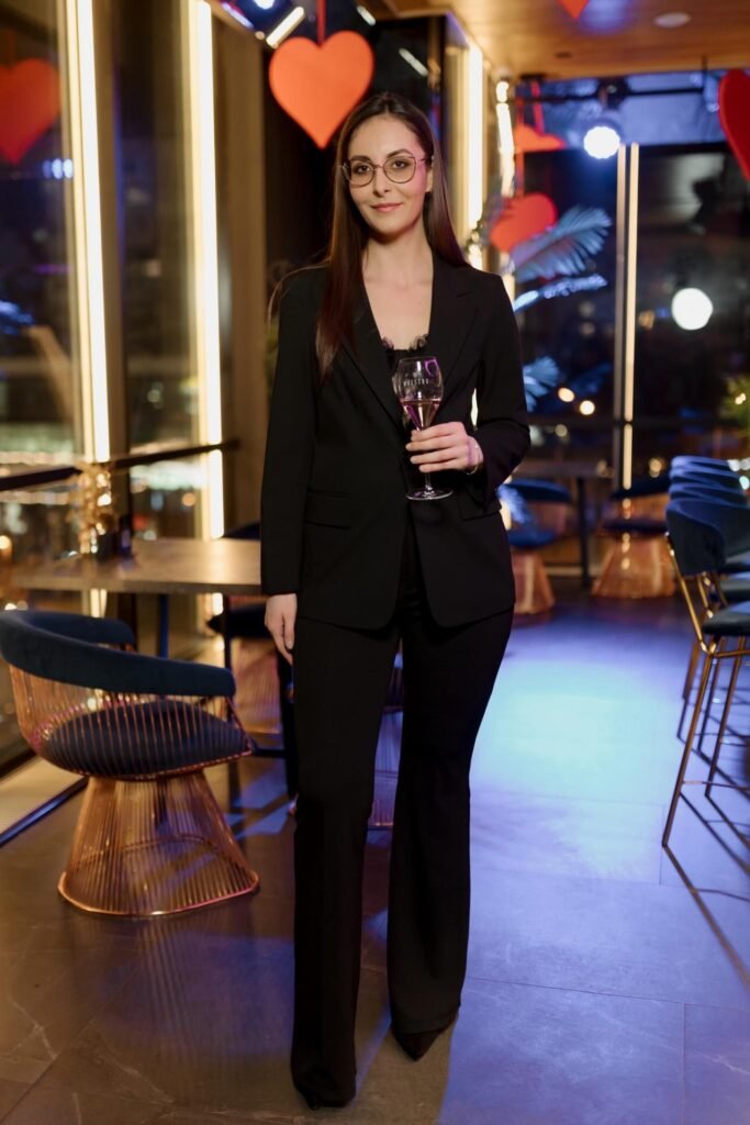 Black Tailored Blazer + Black Flare Trousers + Lace Bodysuit + Black Heels