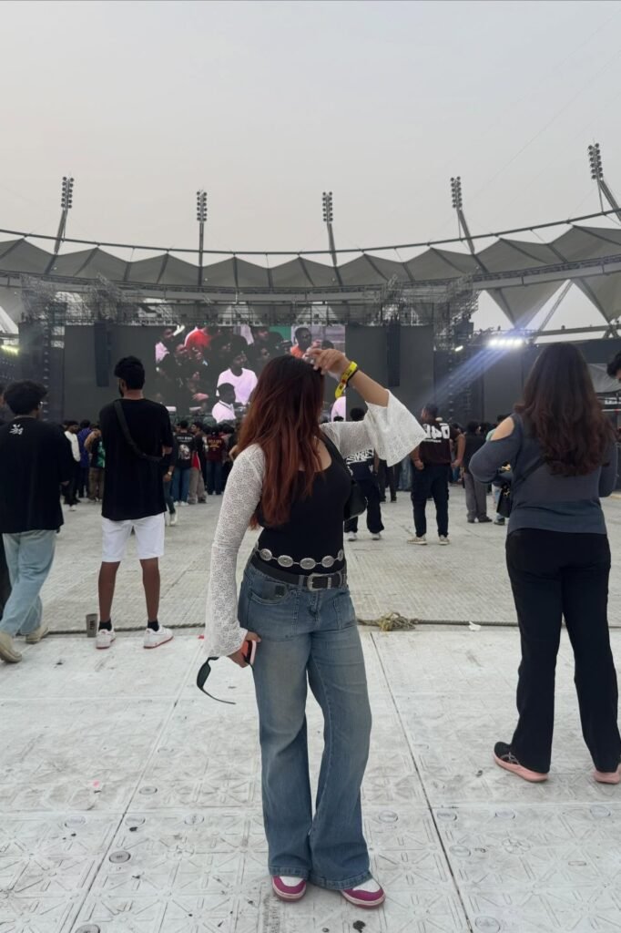 Black Tank Top with White Lace Shrug + Flare Jeans + Pink & White Sneakers