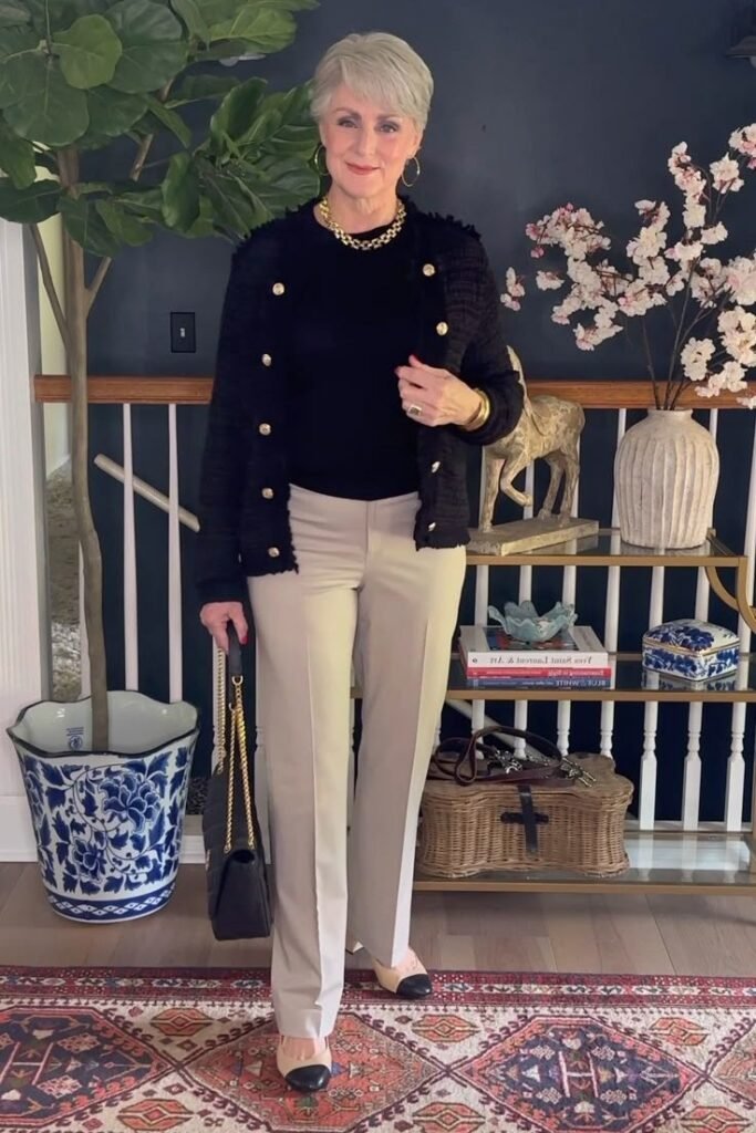 Black Tweed Jacket + Black Mock Neck Top + Beige Straight-Leg Trousers + Two-Tone Cap Toe Flats