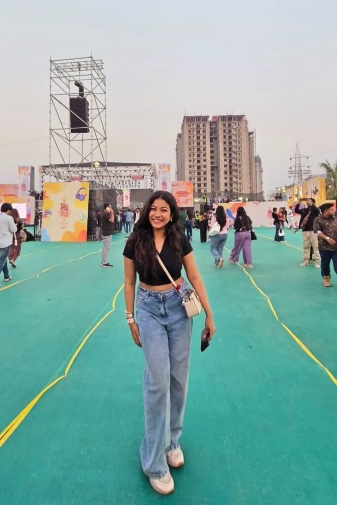 Black V-Neck Crop Top + Wide-Leg Blue Jeans + White Sneakers