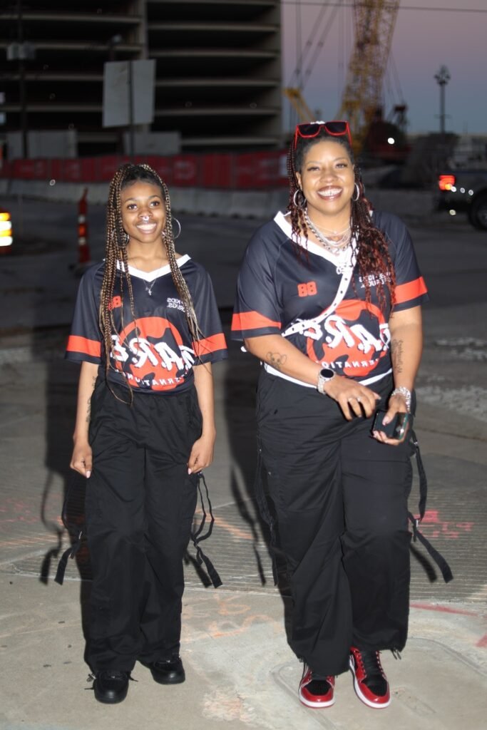 Black and Red V-Neck Sports Jerseys + Black Wide-Leg Cargo Pants + Red and Black Sneakers