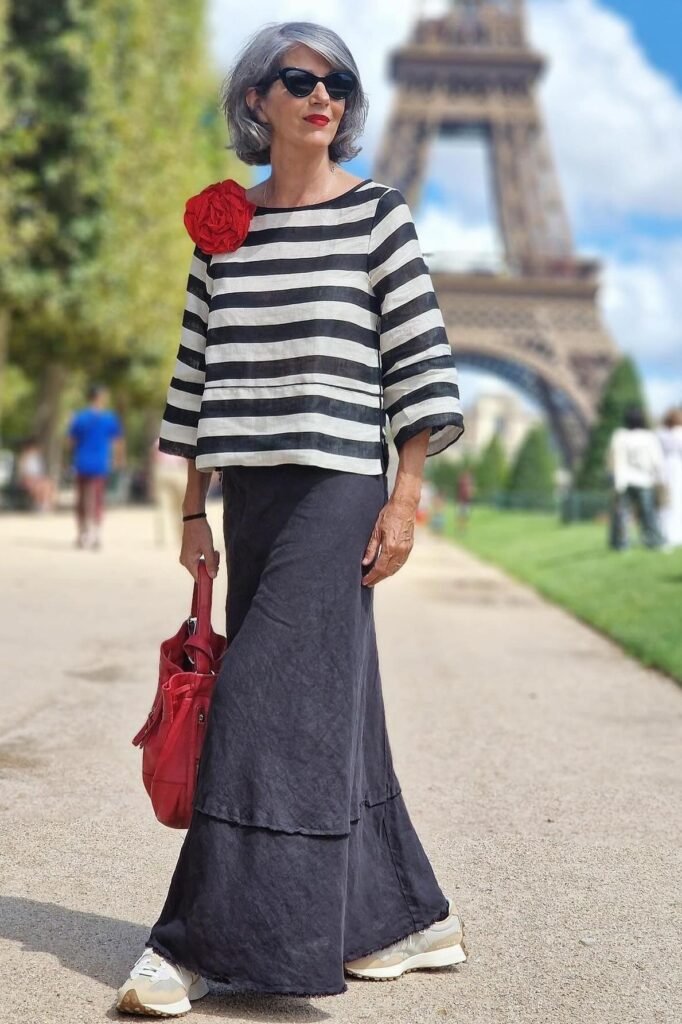 Black and White Horizontal Striped Boatneck Top + Black Tiered Maxi Skirt + White Sneakers + Red Leather Tote