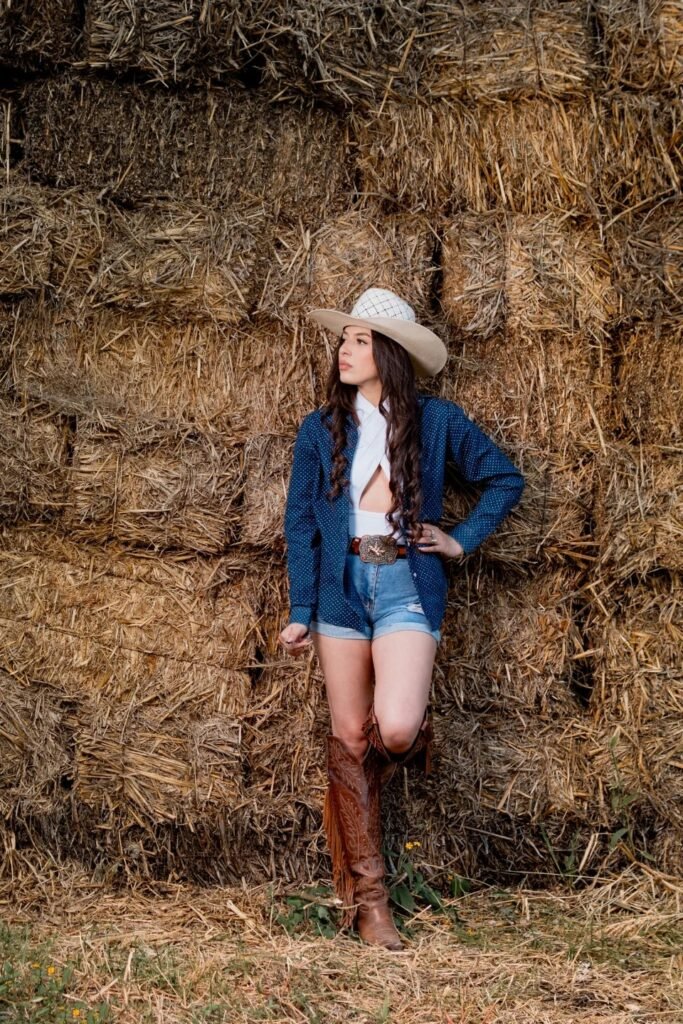 Blue Polka Dot Shirt over White Bodysuit + Denim Shorts + Brown Fringe Cowboy Boots