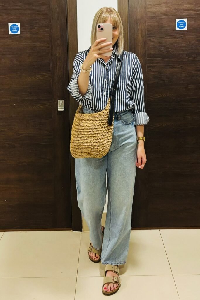 Blue and White Striped Button-Down + Wide-Leg Light Wash Jeans + Beige Buckled Slides