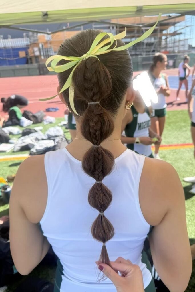 Braid-In-Bubble Ponytail with Yellow Ribbon