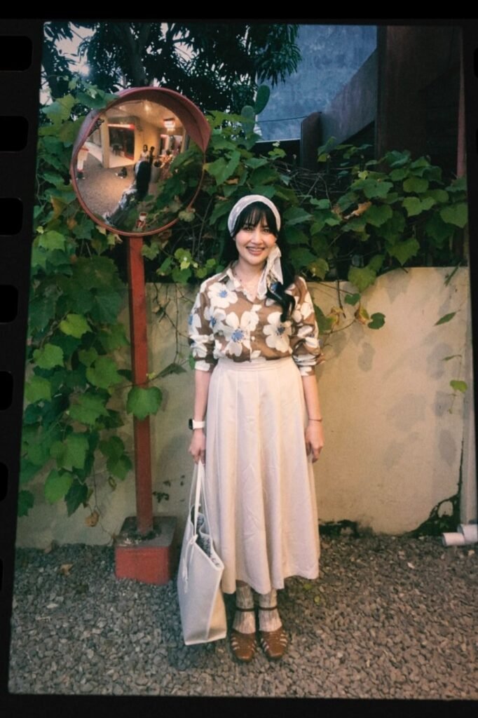 Brown Floral Button-Down Shirt + Beige Pleated Midi Skirt + Brown Strappy Sandals with Socks + White Headscarf + White Canvas Tote Bag