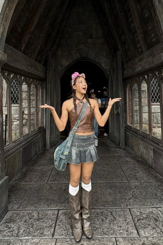 Brown Leather Halter Top + Grey Pleated Denim Mini Skirt + Brown Tall Boots + Pink Bow Headband