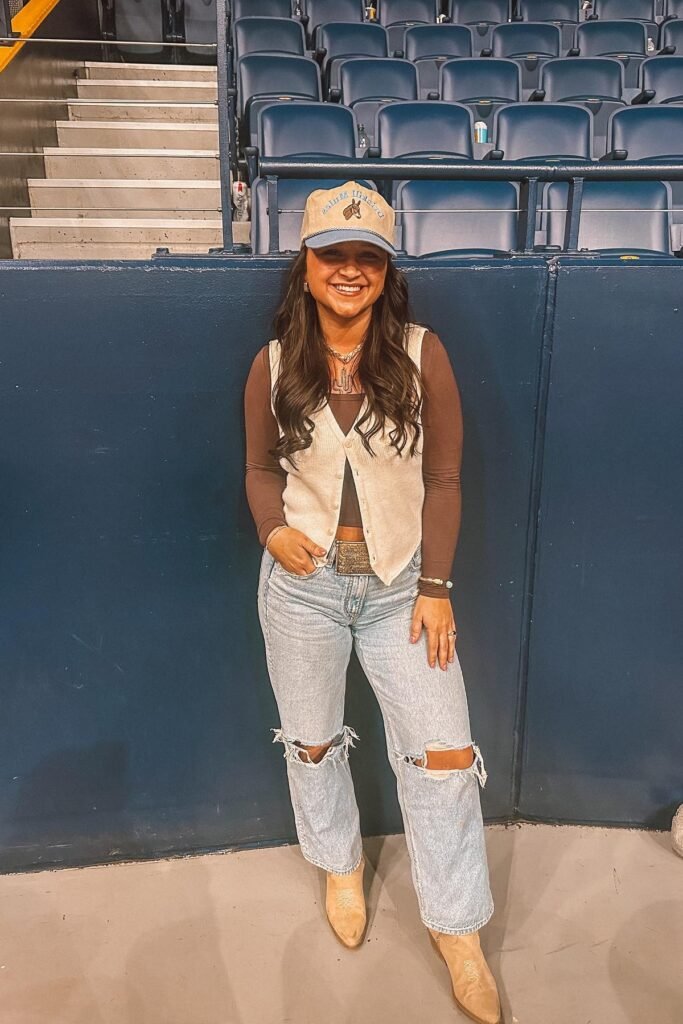 Brown Long Sleeve Top + Cream Button-Up Vest + Distressed Light Wash Jeans + Tan Cowboy Boots