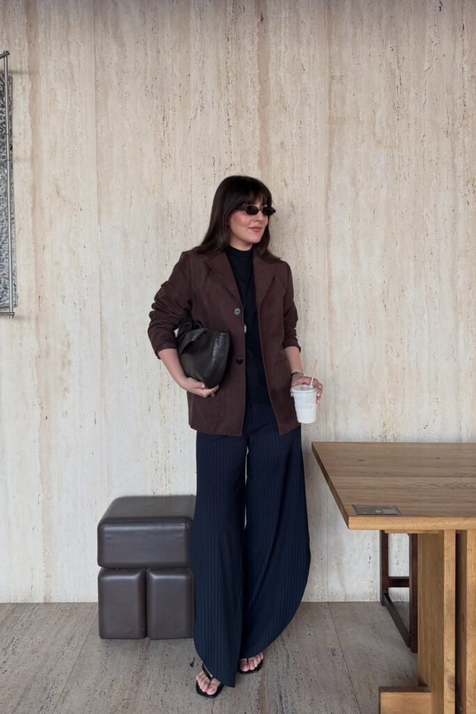 Brown Utility Blazer + Black Turtleneck + Navy Pinstripe Wide-Leg Trousers + Black Flip-Flop Sandals