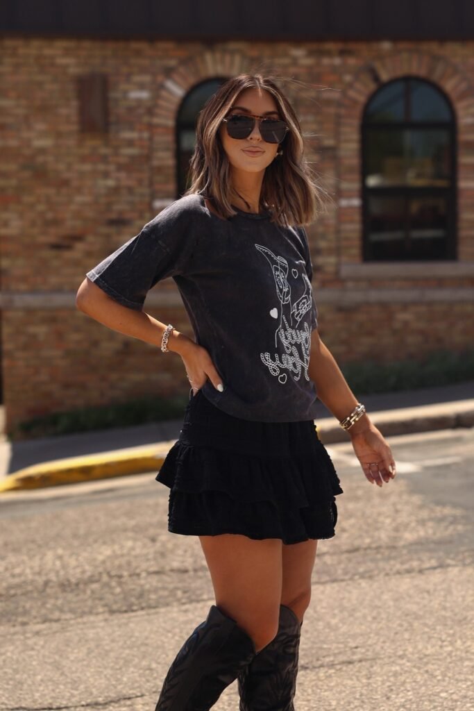 Charcoal Graphic T-Shirt + Black Tiered Mini Skirt + Black Knee-High Western Boots
