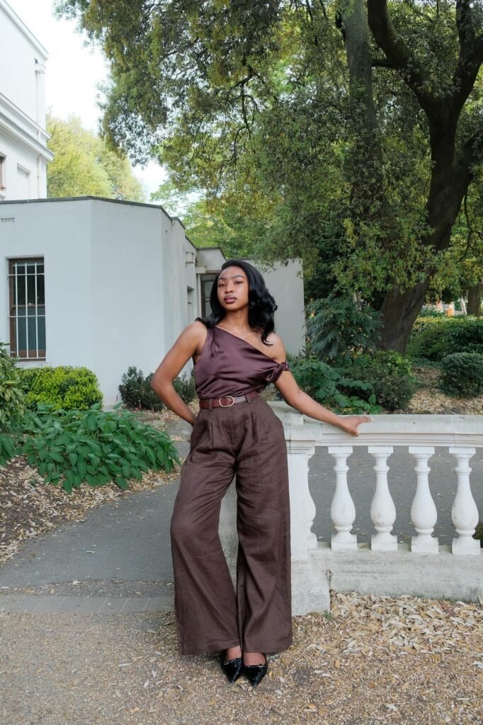 Chocolate Brown One-Shoulder Silk Top + Dark Brown Linen Wide-Leg Trousers + Brown Leather Belt + Black Pointed-Toe Flats