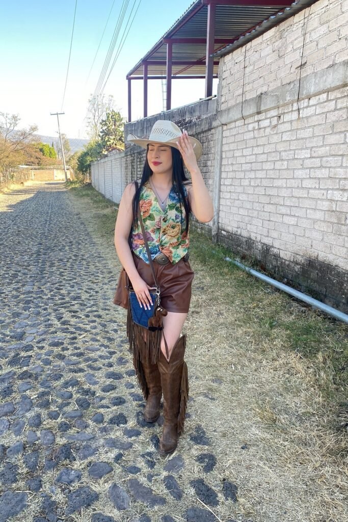 Cream Straw Cowboy Hat + Floral Tapestry Vest + Brown Leather Shorts + Tall Brown Fringe Western Boots