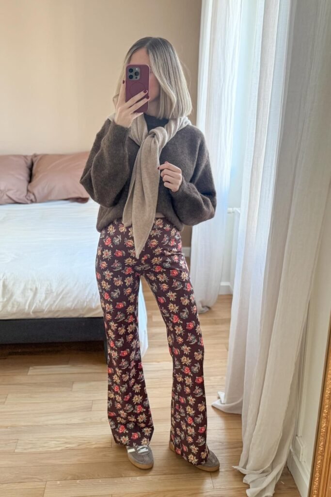 Dark Brown Sweater + Beige Shoulder-Draped Sweater + Brown Floral Flare Pants + Grey Sneakers