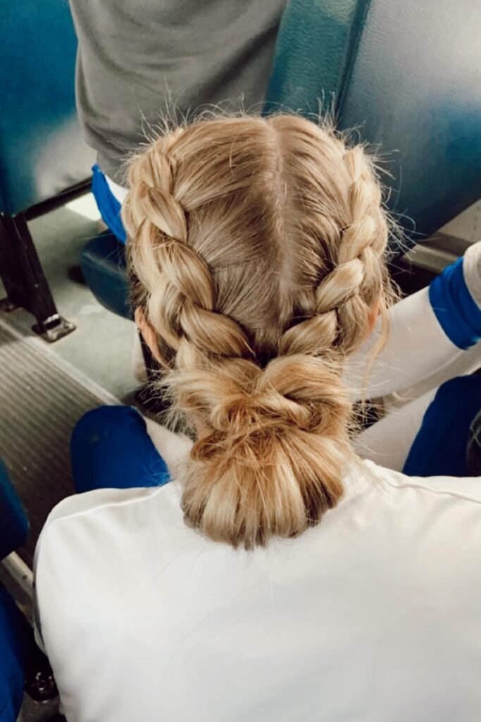 Double Dutch Braids into a Messy Low Bun