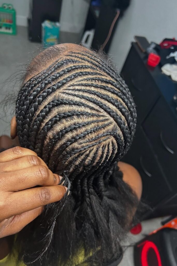 Dynamic Swirl Pattern Cornrows with Natural Hair Texture