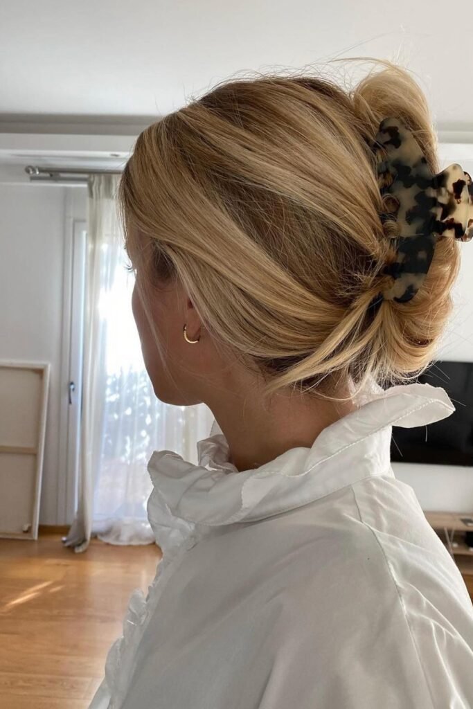 Effortless Low Bun with Tortoise Shell Clip and Gold Hoop Earrings