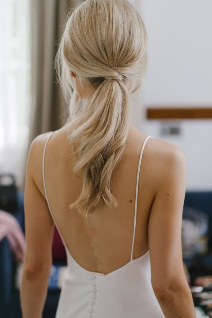 Elegant Low Ponytail with Twisted Hair Wrap
