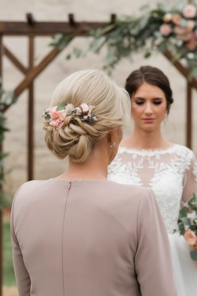 Elegant Twisted Low Bun with Floral Accent