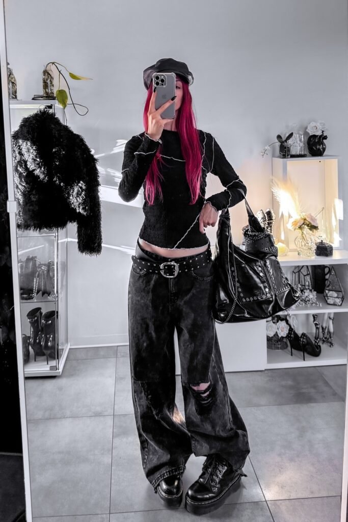 Exposed-seam Black Long-sleeve Top + Distressed Oversized Black Jeans + Studded Belt + Platform Boots