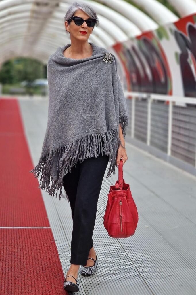 Grey Fringed Poncho + Black Slim-Cut Trousers + Patterned Mary Jane Flats