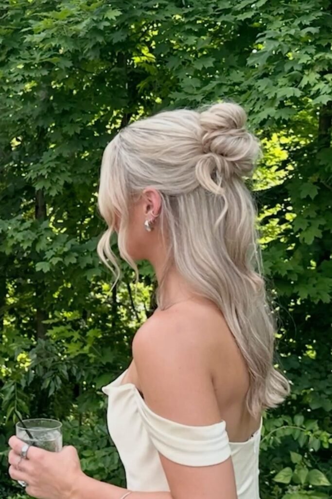 Half-Up Messy Top Knot with Face-Framing Strands