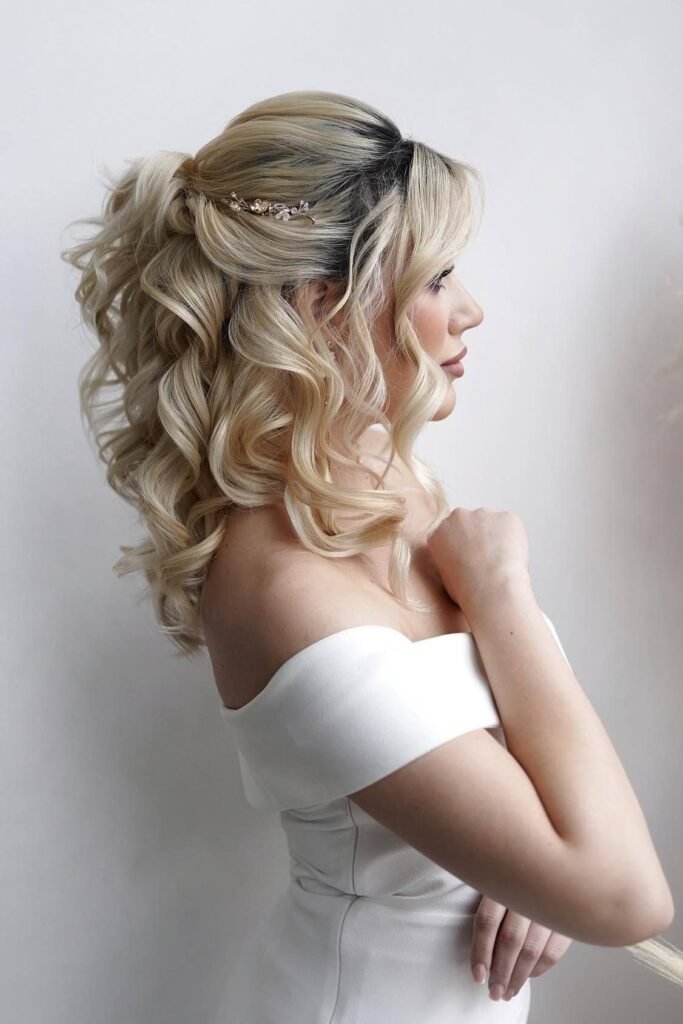 High-Volume Platinum Blonde Half-Updo with Delicate Rose Gold Clip