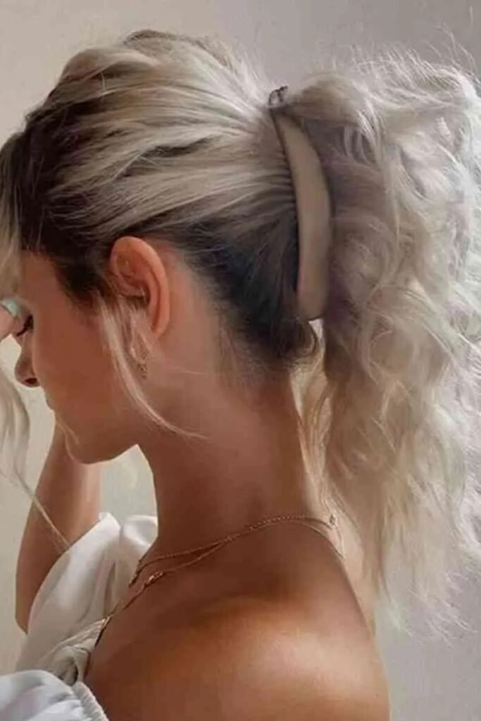 High Voluminous Ponytail Secured with Wide Arched Clip